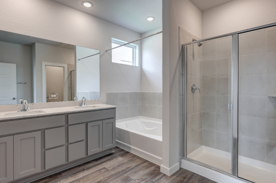 A bathroom with a glass shower.