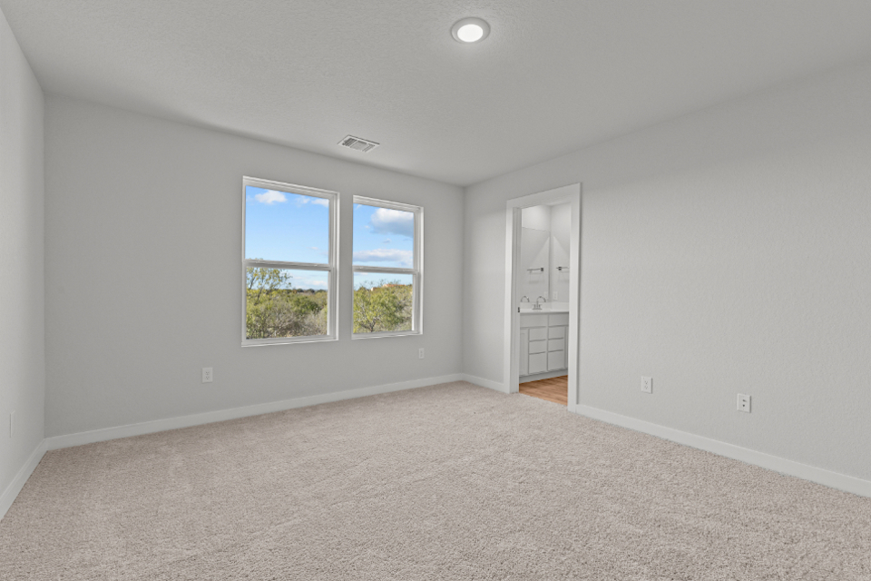 A room with a window and a door.