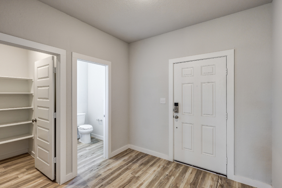 A bathroom with white walls.