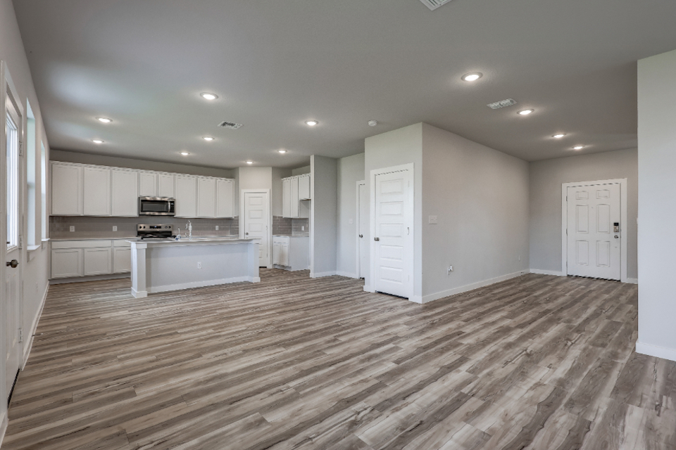 A large kitchen with white cabinets.