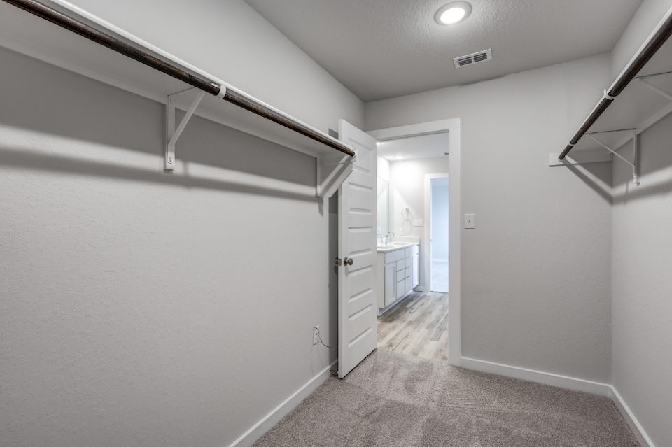 A hallway with white walls.