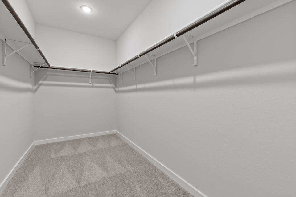 A white room with a tile floor.