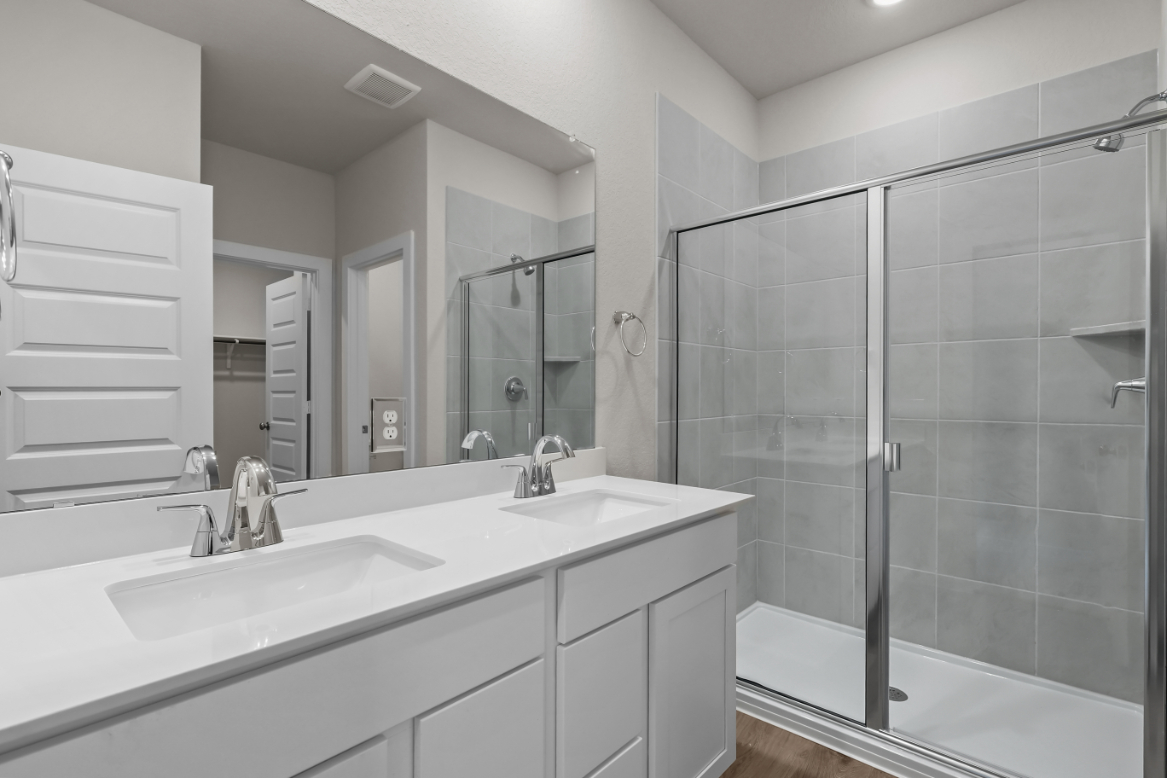 A bathroom with a glass shower.