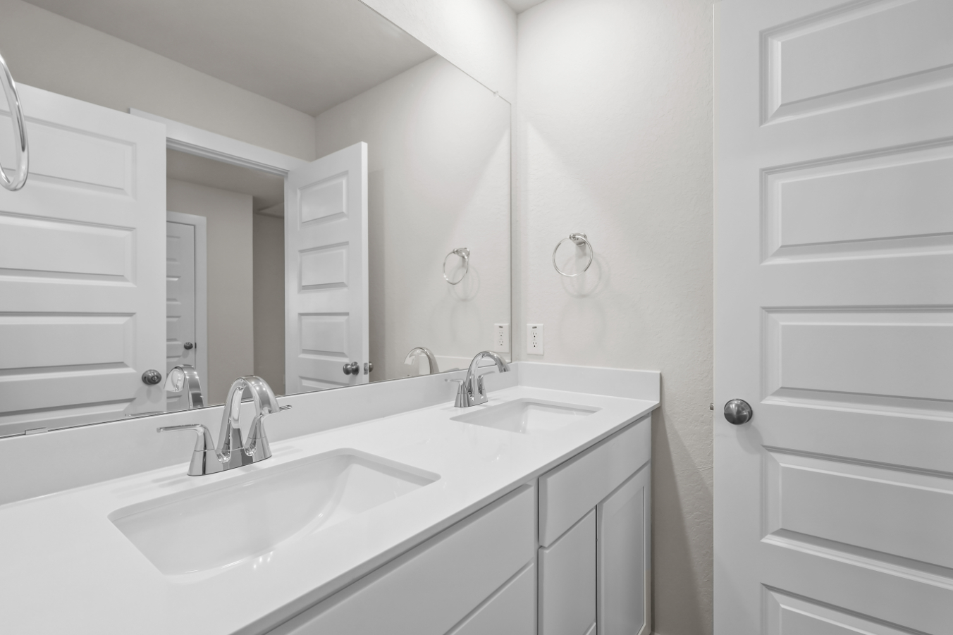A bathroom with two sinks.
