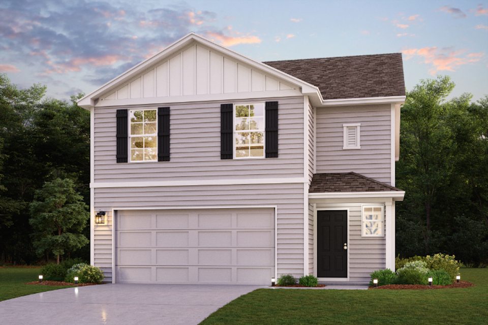 A white house with a garage.