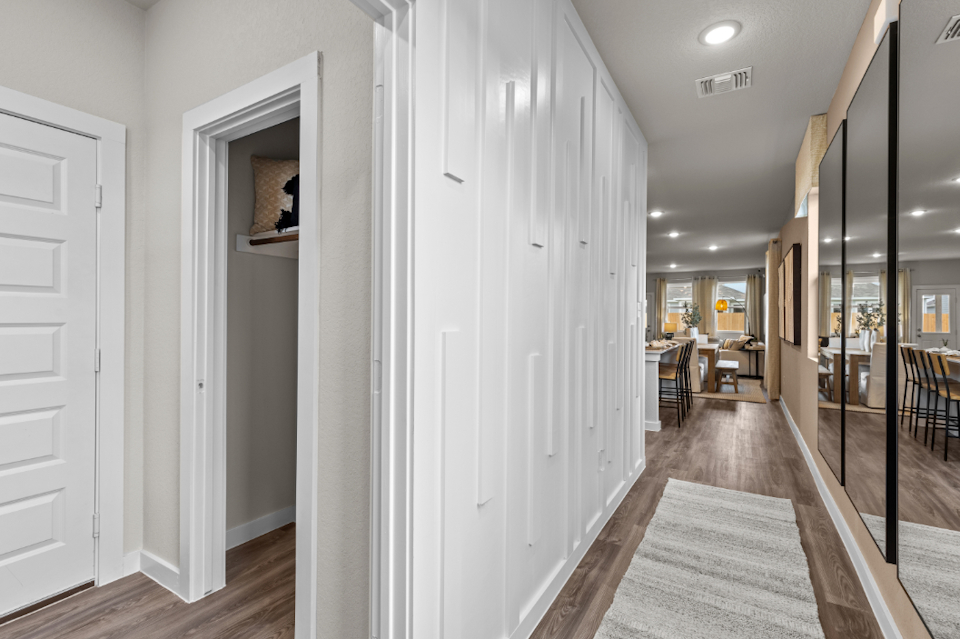 A hallway with white doors.