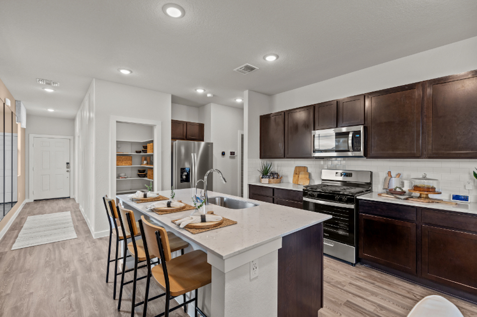 A kitchen with a large island.