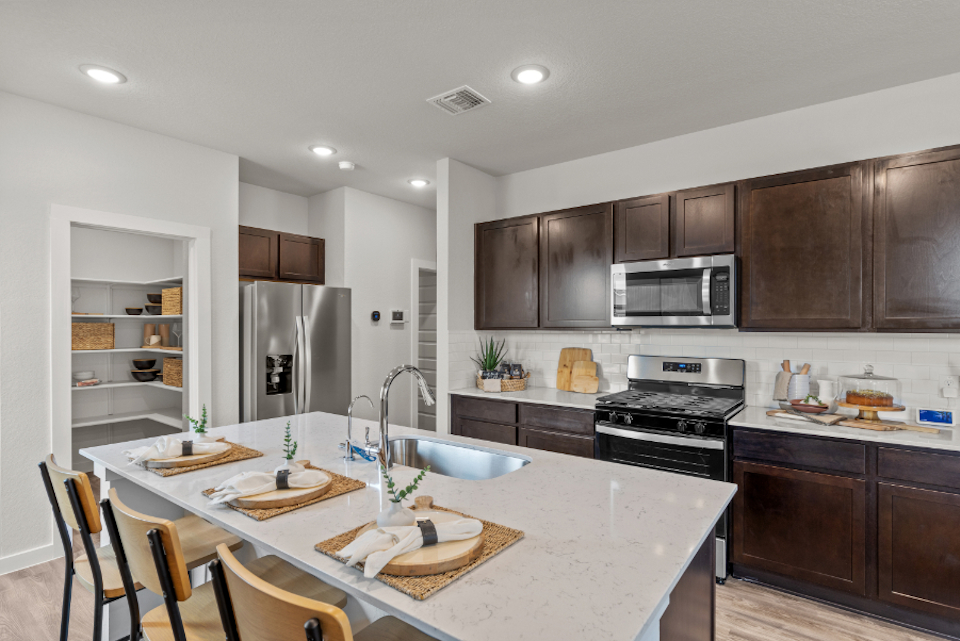 A kitchen with a large island.