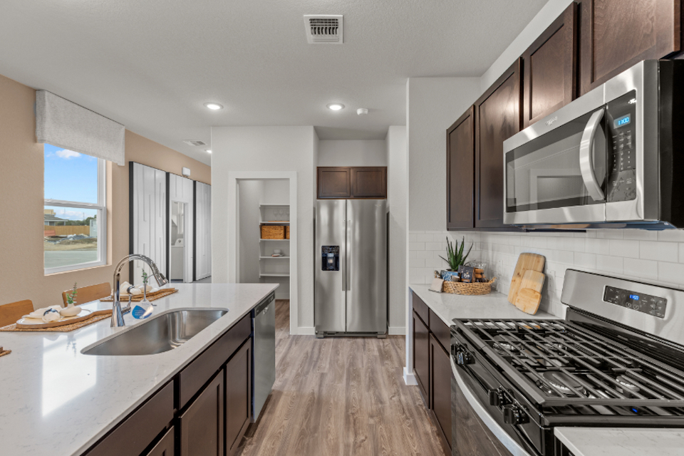 A kitchen with a stove and oven.