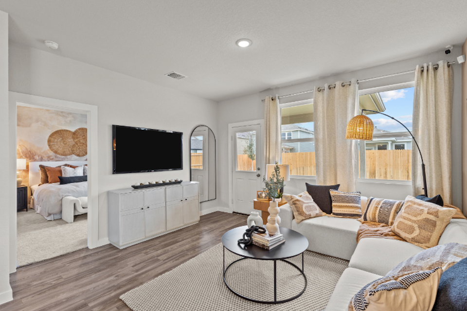 A living room with a tv and couches.