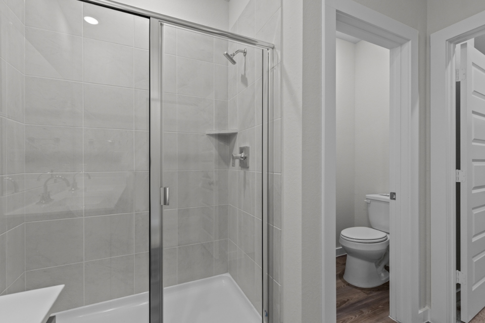 A bathroom with a glass shower.