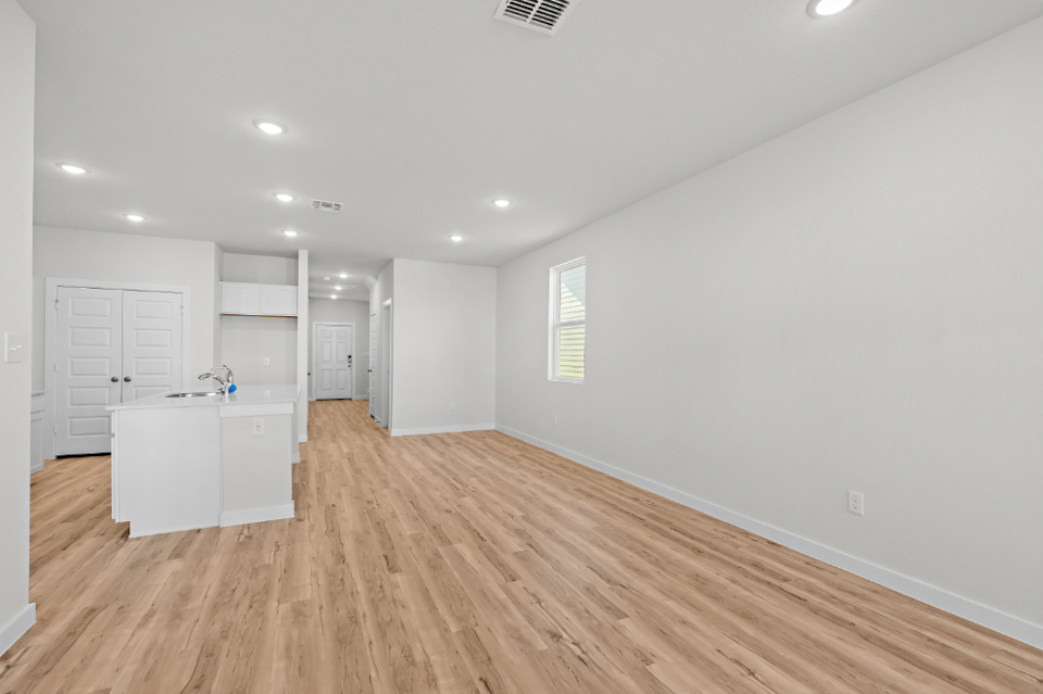 A room with white cabinets.