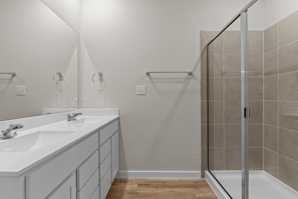 A bathroom with a glass shower.