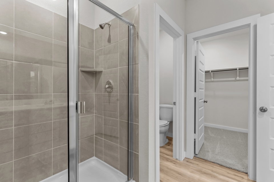 A bathroom with a glass shower.