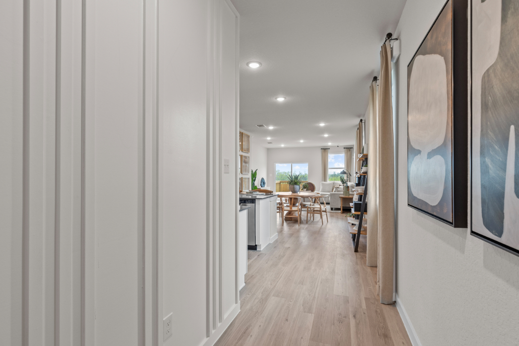 A long hallway with white walls.