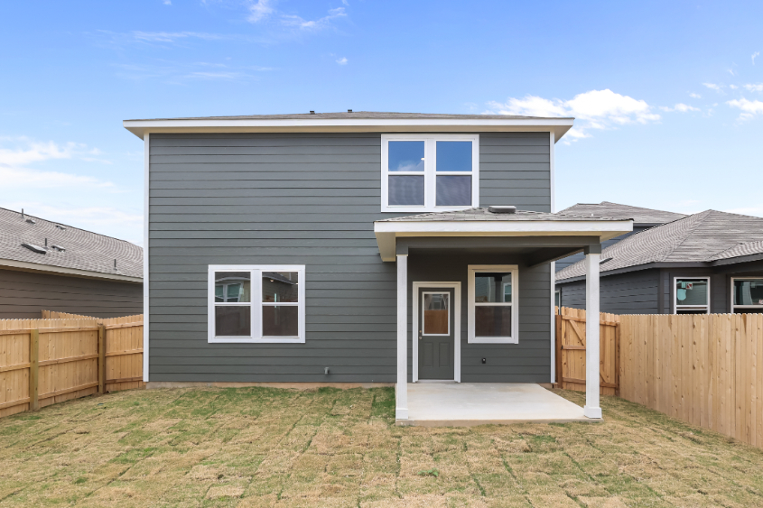 A house with a fence around it.