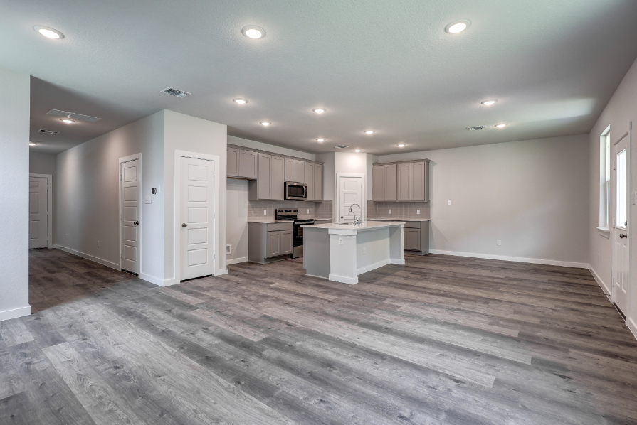 A large kitchen with white cabinets.