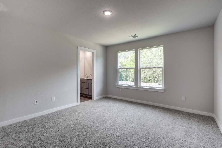 A room with a window and a door.