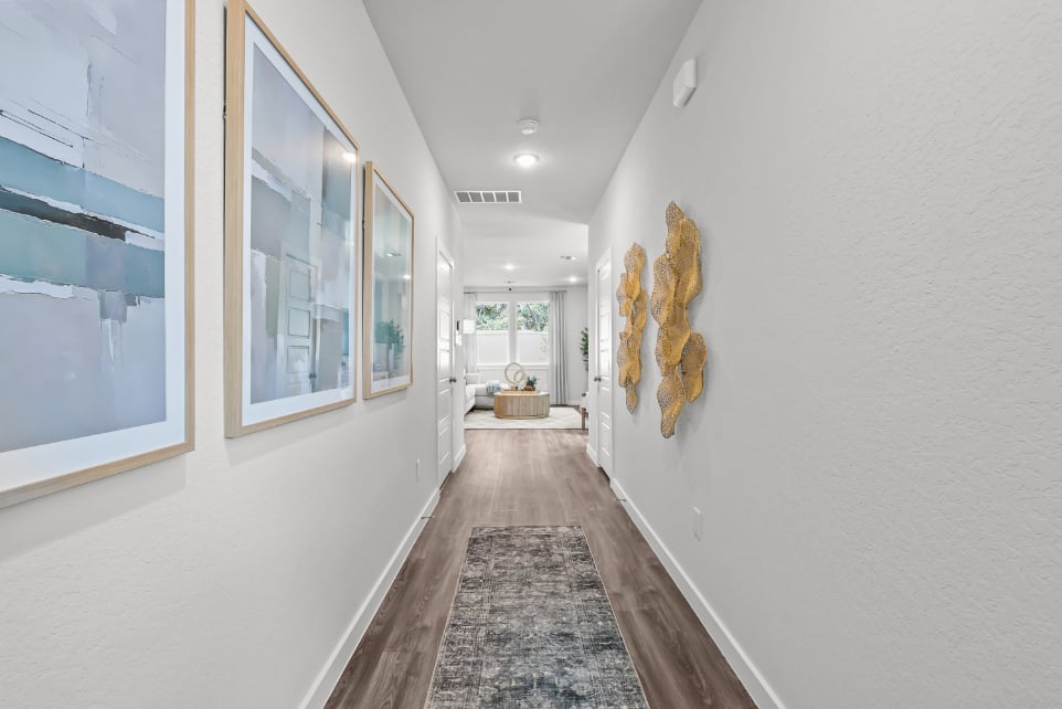 A hallway with white walls.