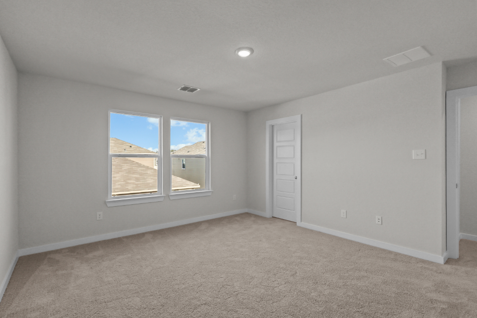 A room with a window and a door.