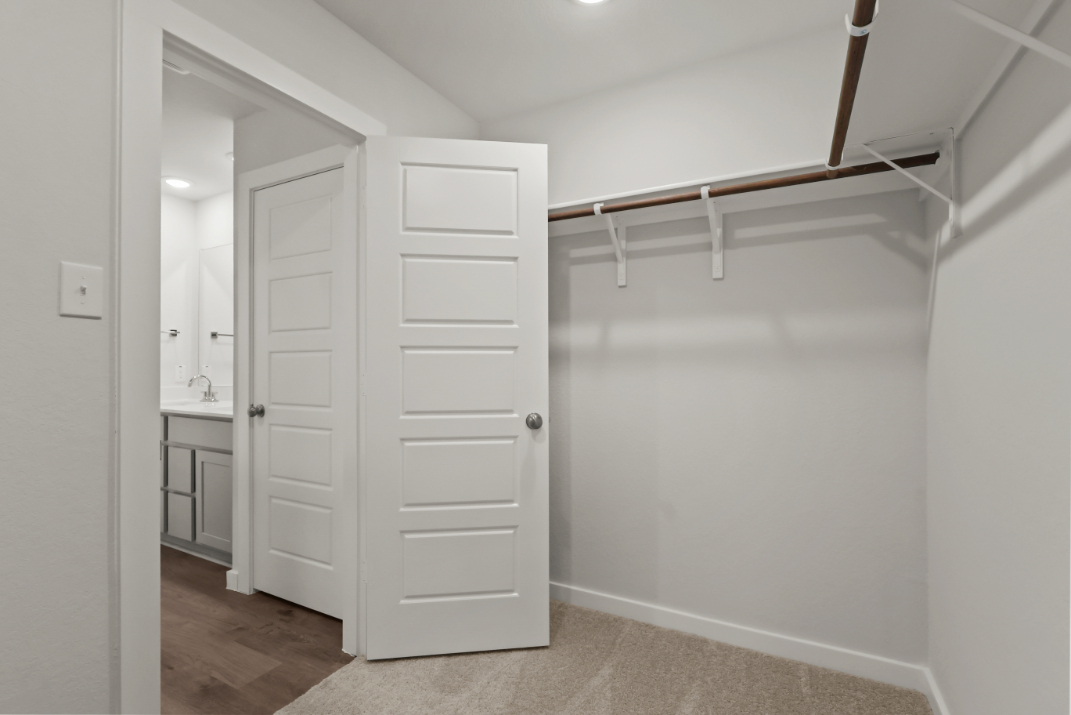 A white closet in a room.