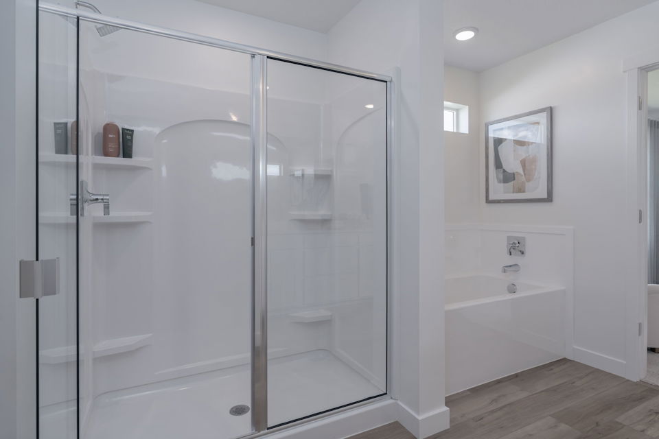 A bathroom with a glass shower.
