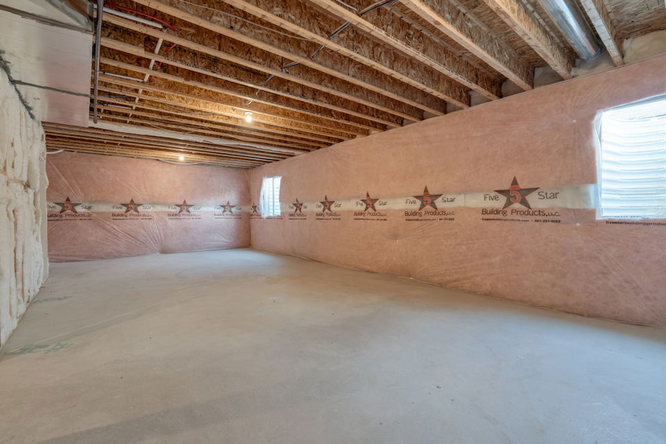 A room with a large wooden ceiling.