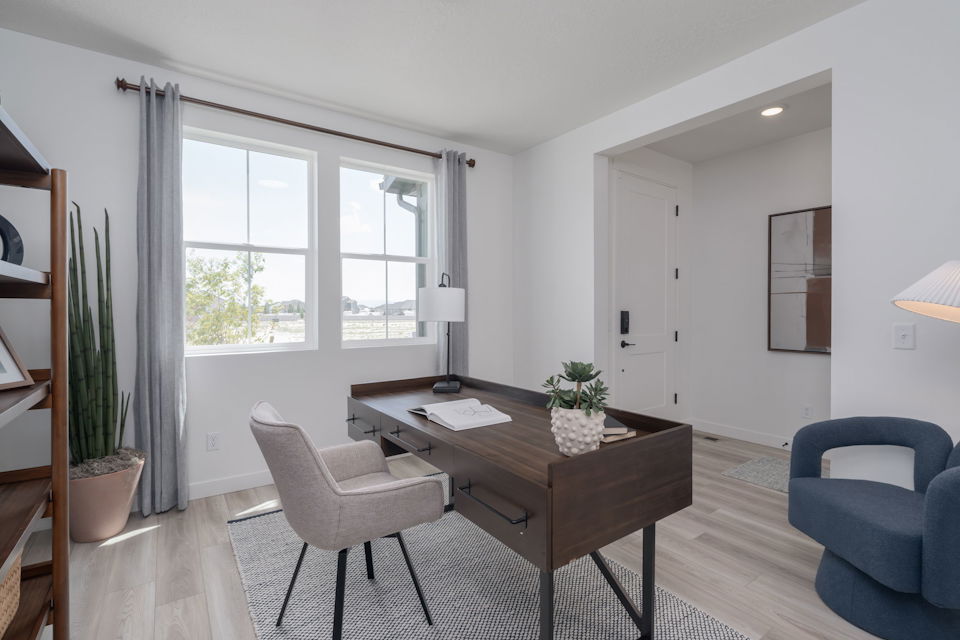 A room with a table and chairs.