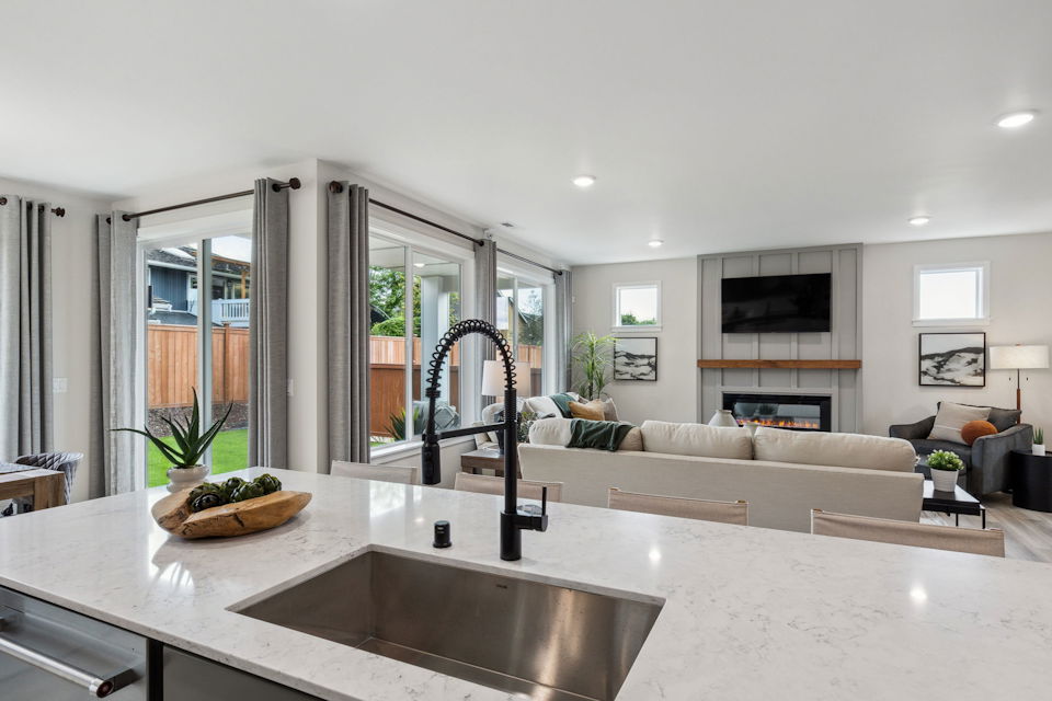 A modern living room with a large glass shower.