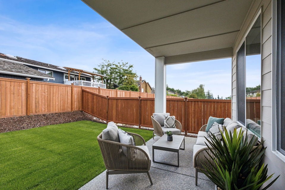 A patio with a table and chairs.