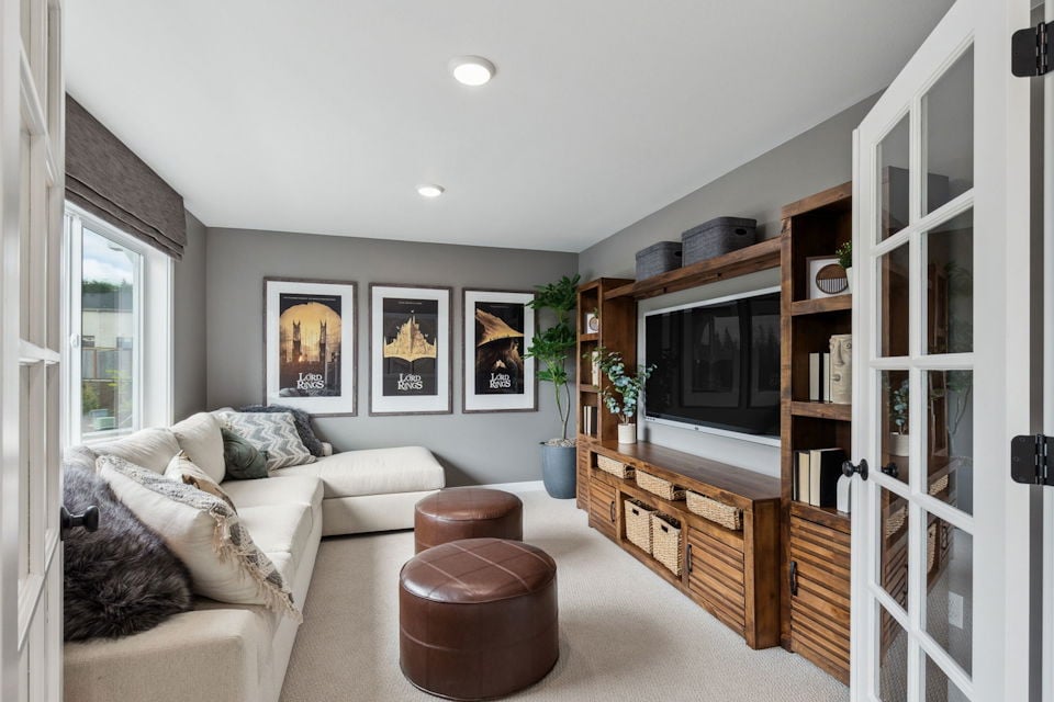 A living room with a couch and a tv.