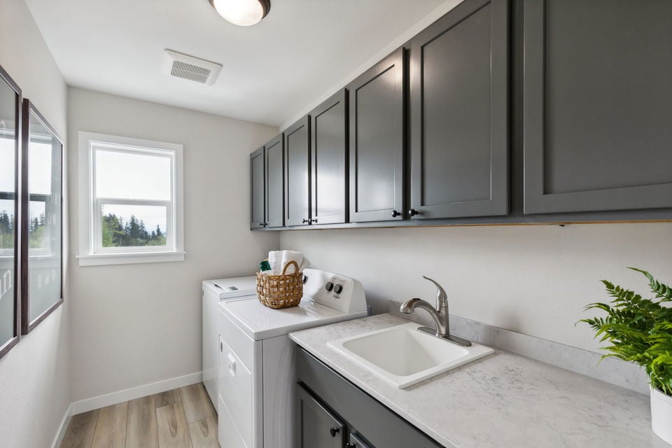 A kitchen with black cabinets.