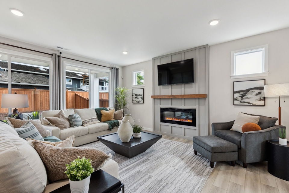 A living room with a fireplace.