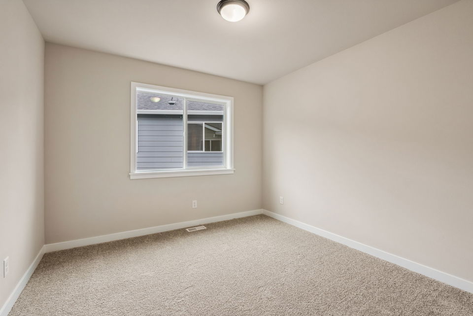 A room with a window and a light.