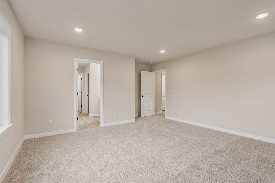 A long hallway with white walls.