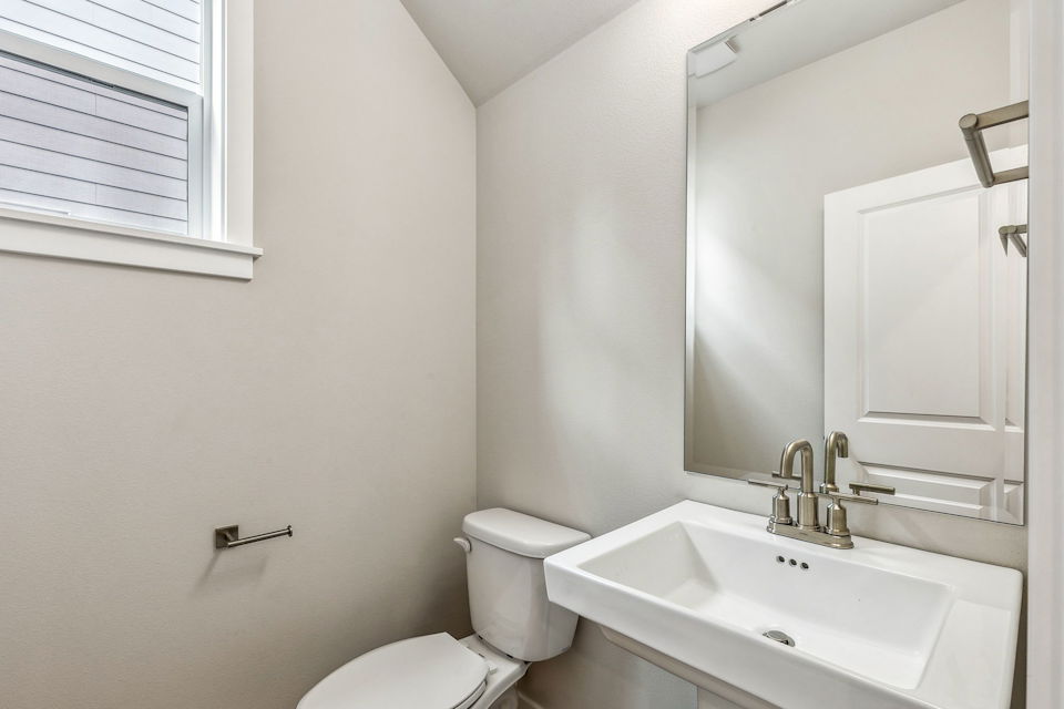 A bathroom with a sink and toilet.