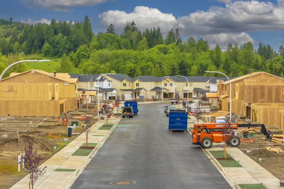 A construction site with a few trucks.
