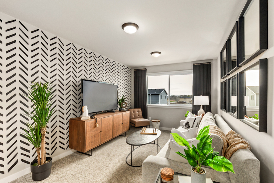 A living room with a tv and couches.