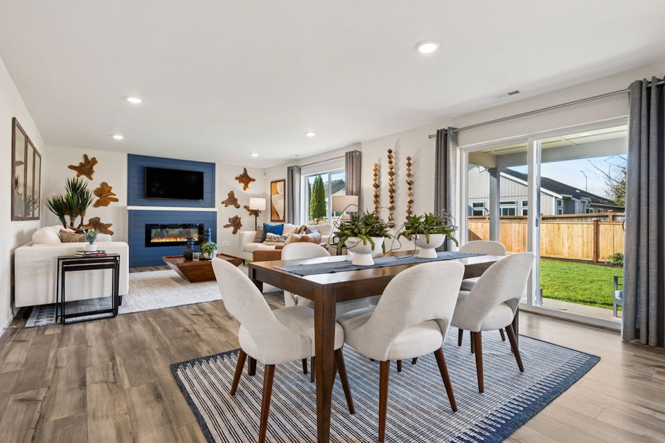 A dining room with a large window.