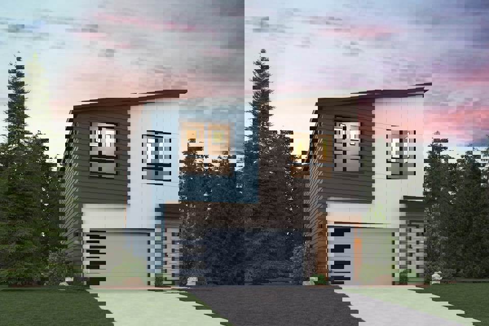 A house with a garage and trees.