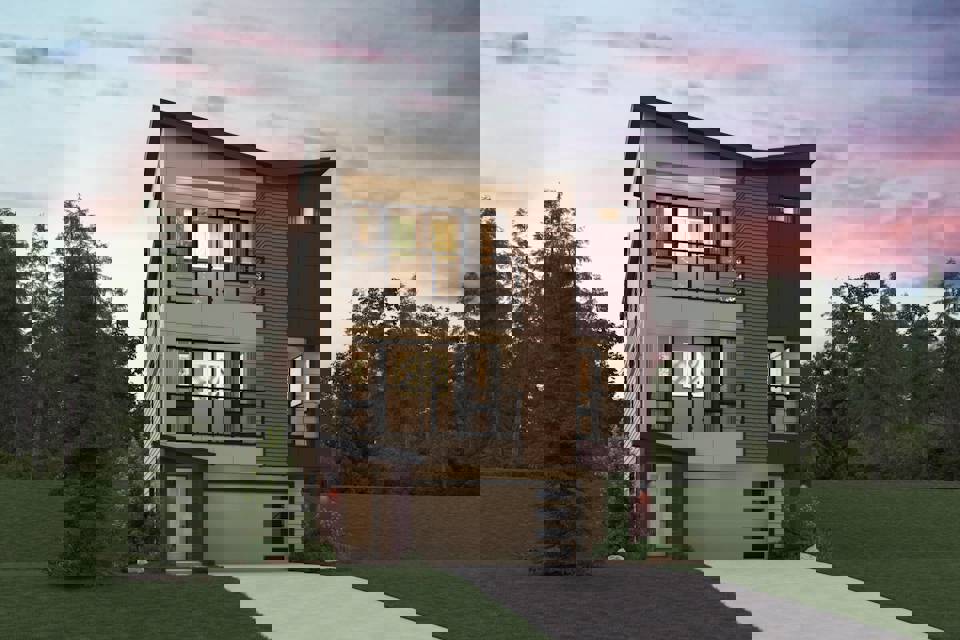 A house with a driveway and trees in the back.