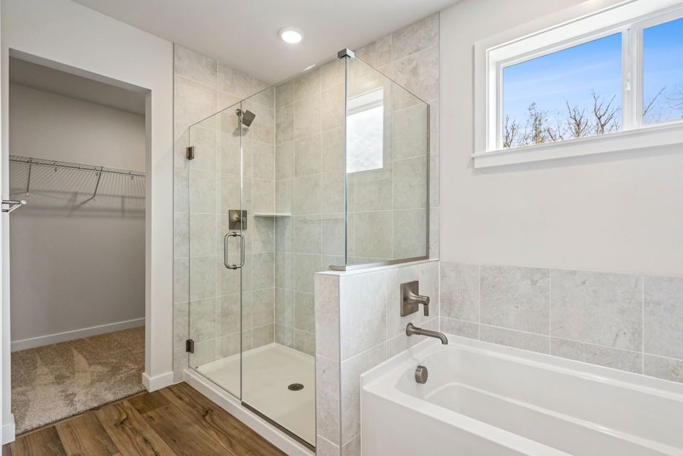 A bathroom with a glass shower.