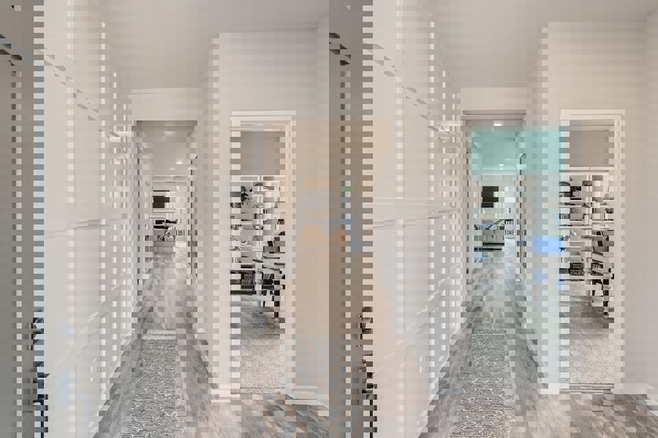 A hallway with white walls.