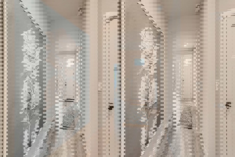 A hallway with white doors.