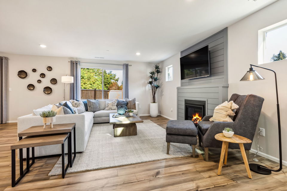 A living room with a fireplace.