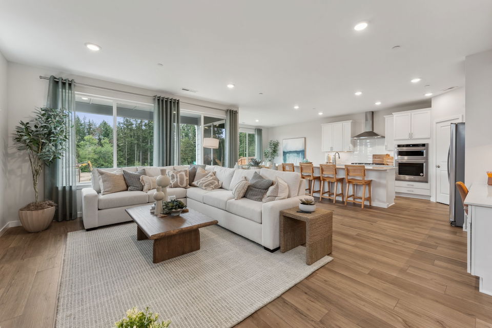 A large living room with a large window.