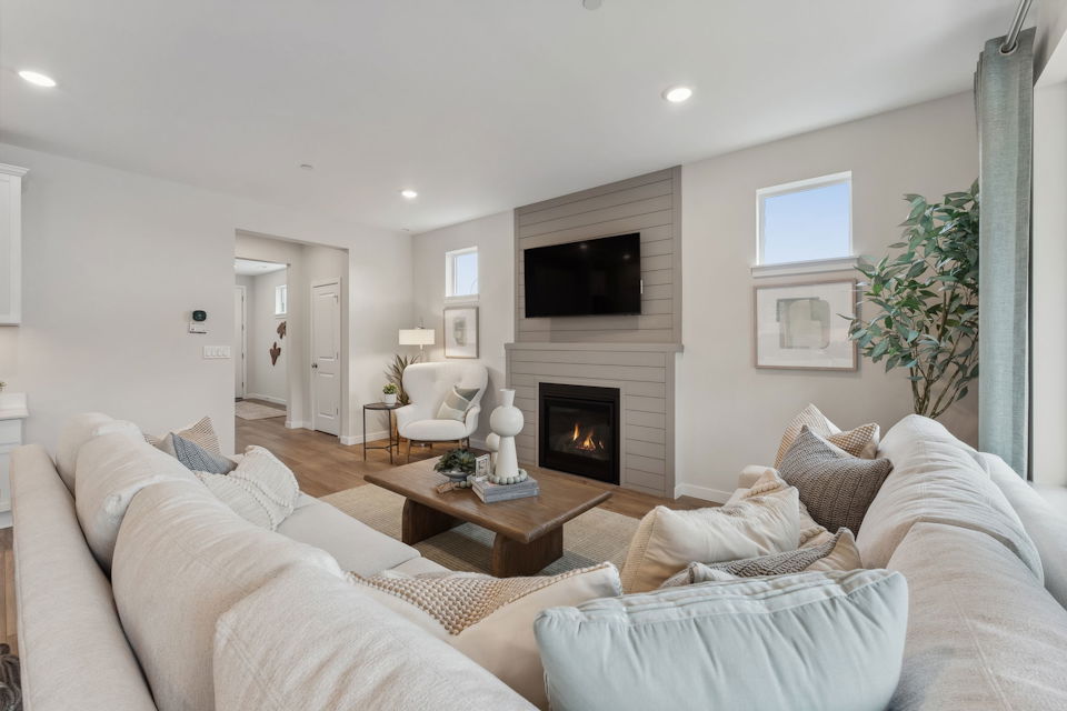 A living room with a fireplace.