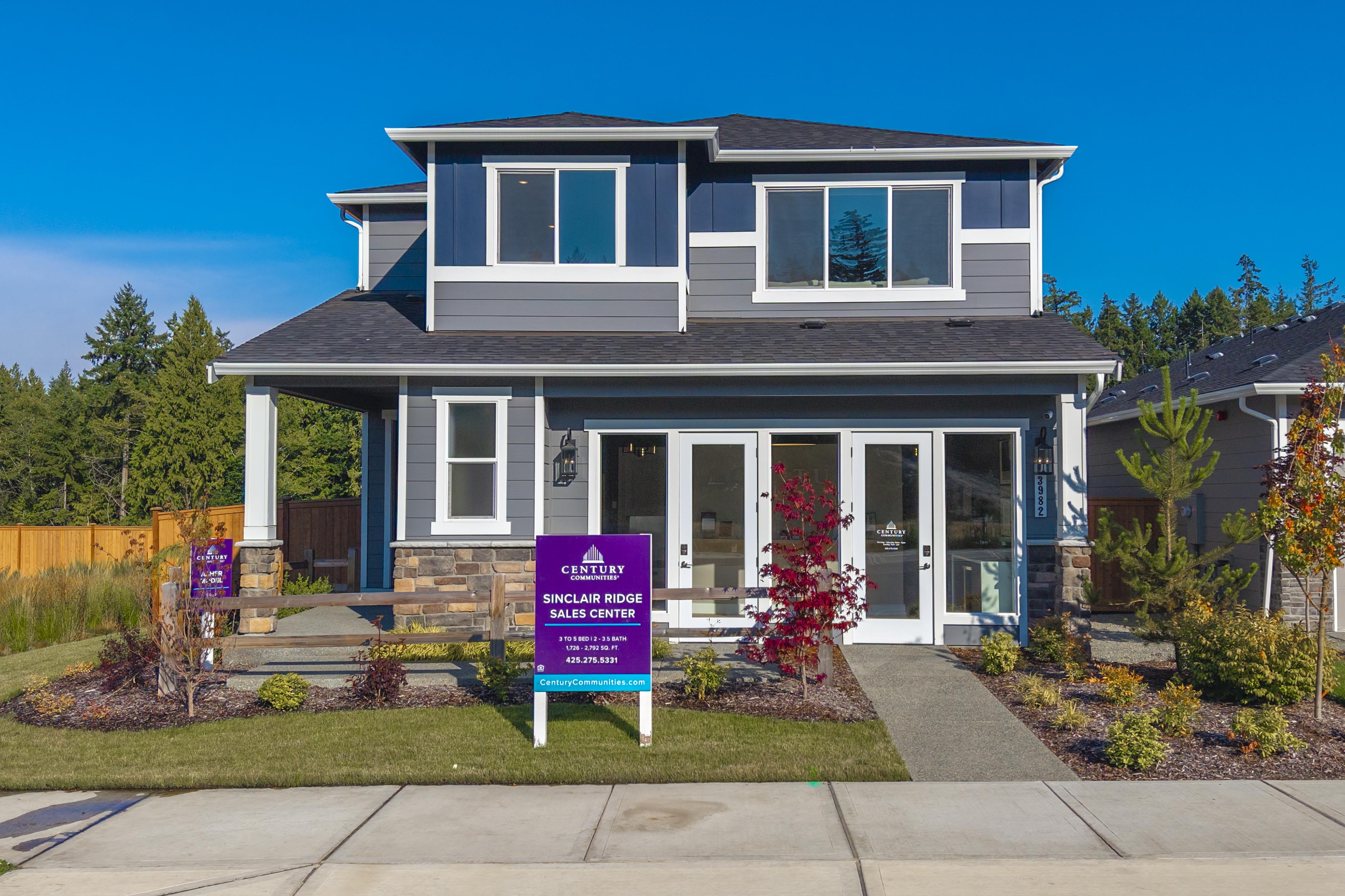 A house with a sign in front.