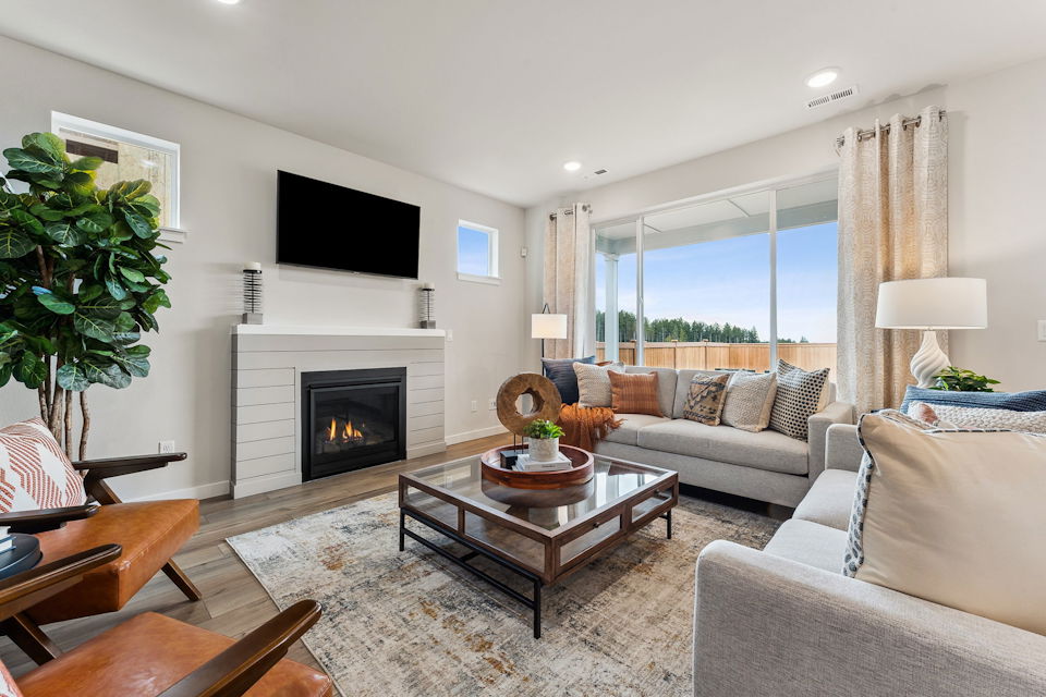 A living room with a fireplace.