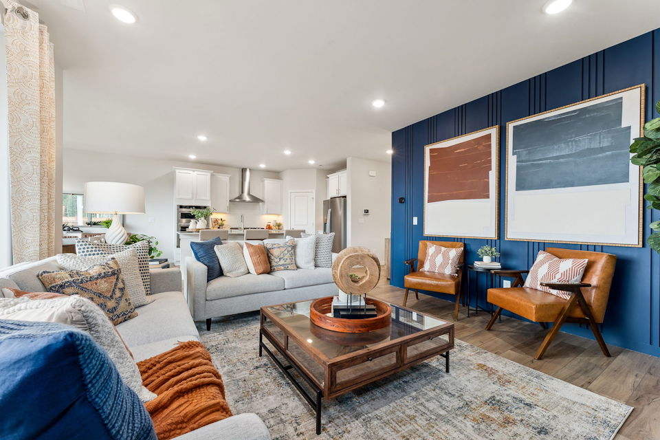 A living room with a large television.